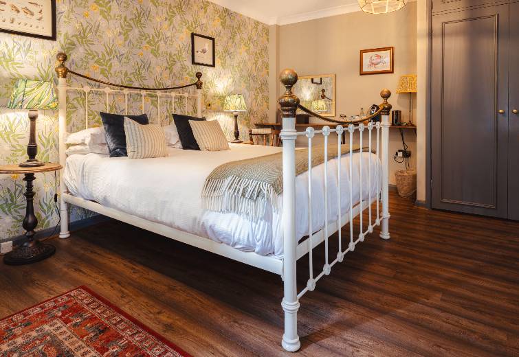 Bedroom with four poster bed in a vintage style 